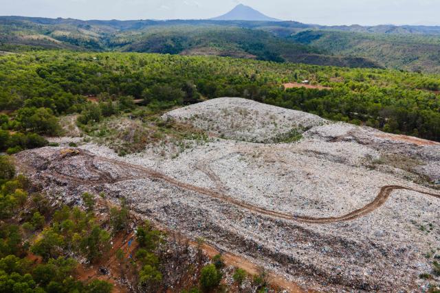 This aerial picture shows a landfill near the Sultan Iskandar Muda international airport in Blang Bintang, Aceh province on October 27, 2025. (Photo by CHAIDEER MAHYUDDIN / AFP/Chaideer MAHYUDDIN / AFP)