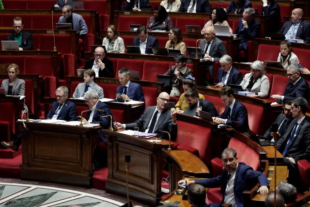 France's Economy and Finance Minister Roland Lescure (down, C), Finance, General Economy, and Budgetary Control Committee General Rapporteur Droite Republicaine's MP Philippe Juvin (down, L) and the committee's President La France Insoumise - Nouveau Front Populaire's MP Eric Coquerel (down, 2nd L) attend the examination a draft finance bill as part of the debate and review of the 2026 State Budget at the French National Assembly, in Paris, on October 27, 2025. (Photo by STEPHANE DE SAKUTIN / AFP)
