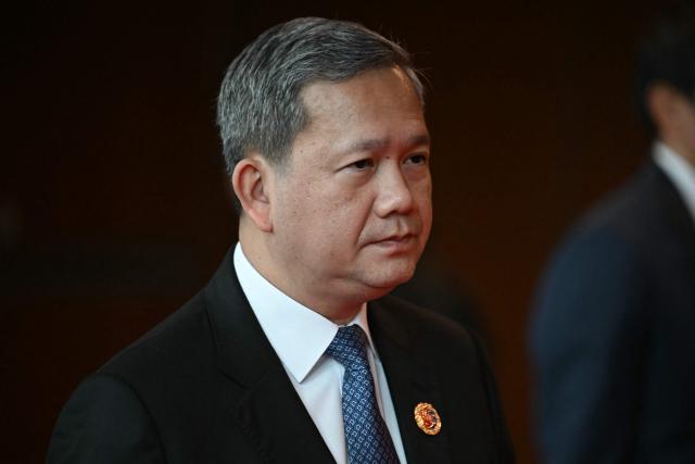 Cambodia's Prime Minister Hun Manet walks between meetings during the 47th Association of Southeast Asian Nations (ASEAN) Summit in Kuala Lumpur on October 27, 2025. (Photo by Lillian SUWANRUMPHA / AFP)