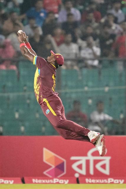 West Indies' Sherfane Rutherford takes a catch to dismiss Bangladesh's Tanzid Hasan during the first Twenty20 international cricket match between Bangladesh and West Indies at a stadium in Chittagong on October 27, 2025. (Photo by MUNIR UZ ZAMAN / AFP)