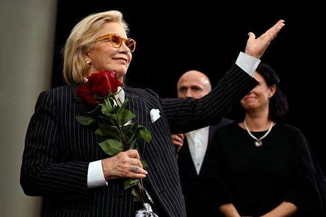 French singer of Bulgarian origin Sylvie Vartan gestures to the audience during the premiere of a documentary "Sylvie Vartan. Out of Love" part of CineLibri film and literature festival in Sofia on October 25, 2025. (Photo by Nikolay DOYCHINOV / AFP)