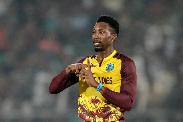 West Indies' Khary Pierre celebrates after taking the wicket of Bangladesh's Nurul Hasan during the first Twenty20 international cricket match between Bangladesh and West Indies at a stadium in Chittagong on October 27, 2025. (Photo by MUNIR UZ ZAMAN / AFP)