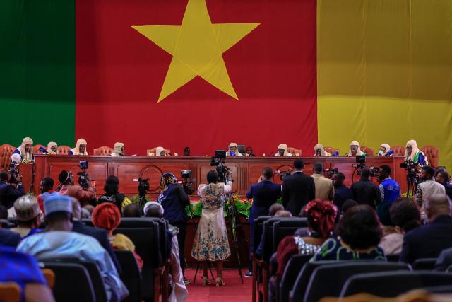 Members of Cameroon’s Constitutional Council read out presidential election results at the Yaounde Conference Centre in Yaounde, on October 27, 2025. Cameroon's President Paul Biya, 92, has been re-elected for an eighth term with 53.7 percent of the vote, according to official results announced by the Constitutional Council on October 27, 2025. (Photo by AFP)