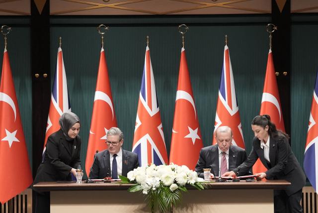 Britain's Prime Minister Keir Starmer (L) and Turkey's President Recep Tayyip Erdogan (R) sign an agreement to sell 20 Eurofighter jets to Ankara in a 10-year deal worth nearly $11 billion at the Presidential Palace in Ankara on October 27, 2025. Britain's Prime Minister Keir Starmer arrived in Ankara on October 27, 2025 to meet President Recep Tayyip Erdogan for talks focused on Turkey's purchase of Eurofighter jets. Starmer landed at an air force base near Ankara, accompanied by UK Defence Minister John Healey and Air Chief Marshall Harv Smyth, the head of Britain's air force, who were welcomed by their Turkish counterparts, Turkey's defence ministry said. (Photo by Stefan Rousseau / POOL / AFP)