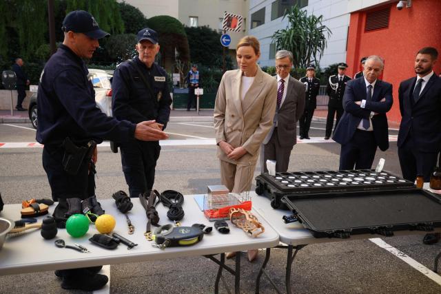 Princess Charlene of Monaco (C) attends the presentation ot the canine brigade in The Principality of Monaco on October 27, 2025. (Photo by Valery HACHE / AFP) / / NO TABLOIDS WEB & PRINT, NO DAILY MAIL, NO DAILY MAIL GROUP, NO VOICI, NO CLOSER