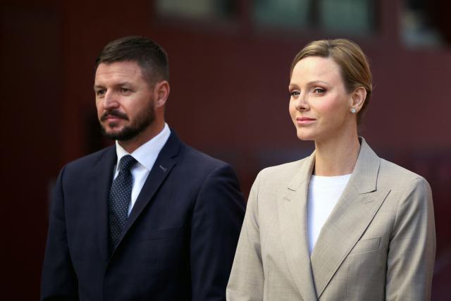 Princess Charlene of Monaco with her brother Gareth Wittstock attend the presentation of the canine brigade in The Principality of Monaco on October 27, 2025. The princess is the initiator of the creation of the canine brigade and she is president of SPA Monaco (Societe Protectrice des animaux) (Photo by Valery HACHE / AFP) / / NO TABLOIDS WEB & PRINT, NO DAILY MAIL, NO DAILY MAIL GROUP, NO VOICI, NO CLOSER