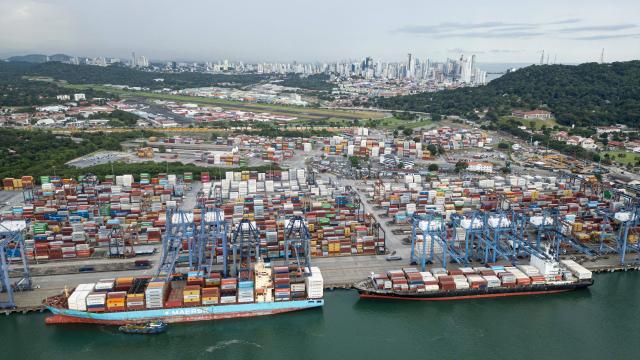 (FILES) This aerial view shows the Port of Balboa at the Pacific entrance of the Panama Canal in Panama City on October 6, 2025. The Panama Canal Authority announced plans on October 27, 2025, to build two ports by 2029 at a cost of 2.6 billion dollars, amid uncertainty over the future of Hong Kong-based concessionaire Hutchison Holdings. (Photo by MARTIN BERNETTI / AFP)