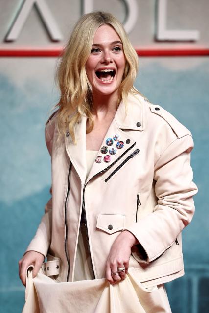 US actor Elle Fanning reacts on the red carpet upon arrival to attend the UK special screening of "Predator: Badlands" at the BFI IMAX in London, on October 27, 2025. (Photo by HENRY NICHOLLS / AFP)