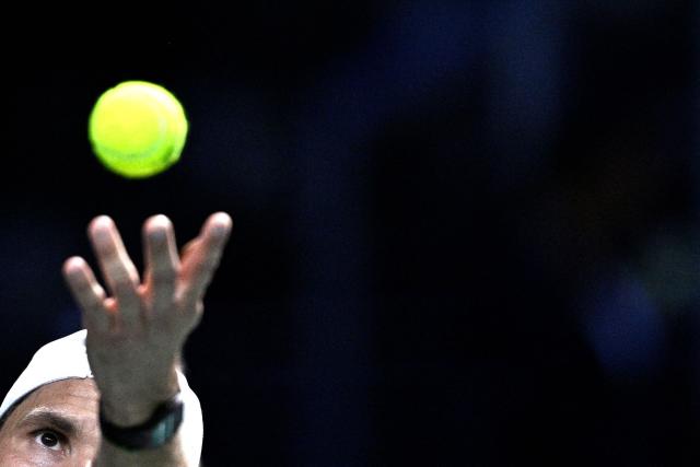 Bulgaria's Grigor Dimitrov serves to France's Giovanni Mpetshi Perricard during their men's singles match on day one of the Paris ATP Masters 1000 tennis tournament at the Paris La Défense Arena in Nanterre, on the outskirts of Paris, on October 27, 2025. (Photo by JULIEN DE ROSA / AFP)