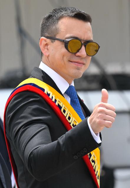 Ecuador's President Daniel Noboa gives the thumbs up during a ceremony marking the 105th anniversary of the founding of the National Aviation and Ecuadorian Air Force Day, at Mariscal Sucre Air Base in Quito, on October 27, 2025- (Photo by Rodrigo BUENDIA / AFP)