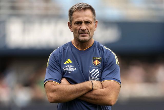 (FILES) Perpignan's French head coach Franck Azema looks on prior to the French Top14 rugby union match between USA Perpignan and Union Bordeaux-Begles (UBB) at the Aime-Giral stadium in Perpignan, south-western France on October 18, 2025. The general manager of Perpignan was relieved of his duties on October 27, 2025, two days after the defeat against Montauban, marking the Catalans' eighth consecutive loss, leaving them at the bottom of the Top 14 with zero points. (Photo by Valentine CHAPUIS / AFP)