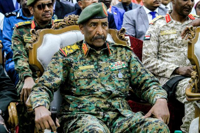 (FILES) Sudan's army chief General Abdel Fattah al-Burhan attends the inauguration of an initiative to support the families of victims killed and injured in the ongoing civil war, in Port Sudan on April 26, 2025. Burhan said on October 27, 2025 that "the army has withdrawn from El-Fasher", following an announcement the city was seized by the Rapid Support Forces (RSF) paramilitary group which his troops have been fighting since April 2023. (Photo by Ebrahim Hamid / AFP)