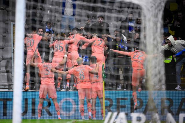 Porto players celebrate after scoring their second goal during the Portuguese league football match between Moreirense FC and FC Porto at Comendador Joaquim de Almeida Freitas stadium in Moreira de Conegos on October 27, 2025. (Photo by Miguel RIOPA / AFP)
