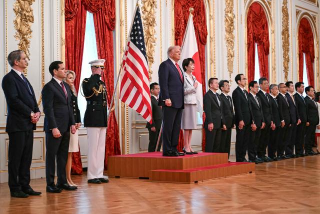 Japan's Prime Minister Sanae Takaichi (centre R) and US President Donald Trump review an honour guard of the Japan Self-Defense Force at the Akasaka State Guest House in Tokyo on October 28, 2025. (Photo by ANDREW CABALLERO-REYNOLDS / AFP)