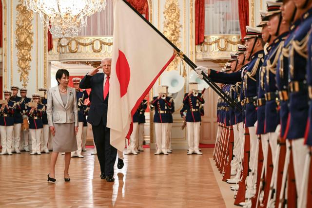 Japan's Prime Minister Sanae Takaichi (L) and US President Donald Trump review an honour guard of the Japan Self-Defense Force at the Akasaka State Guest House in Tokyo on October 28, 2025. (Photo by ANDREW CABALLERO-REYNOLDS / AFP)
