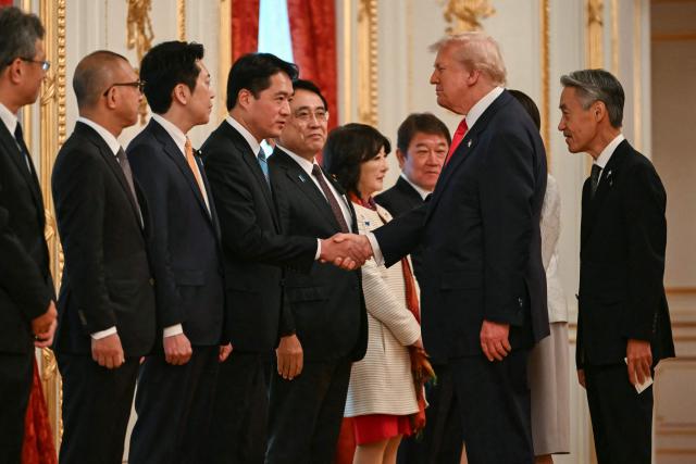 US President Donald Trump meets members of Japan's delegation at the Akasaka State Guest House in Tokyo on October 28, 2025. (Photo by ANDREW CABALLERO-REYNOLDS / AFP)