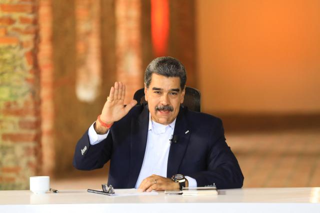 This handout picture released by the Venezuelan Presidency shows Venezuela's President Nicolas Maduro gesturing during an official TV show in Caracas on October 27, 2025. Venezuelan President Nicolas Maduro on October 27, announced he had suspended an energy agreement with Trinidad and Tobago in response to the neighboring island nation's welcoming of a US warship. (Photo by Handout / Venezuelan Presidency / AFP)