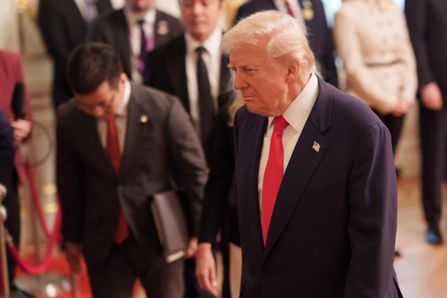 US President Donald Trump reviews an honour guard of the Japan Self-Defense Force at the Akasaka State Guest House in Tokyo on October 28, 2025. (Photo by Nicolas Datiche / POOL / AFP)