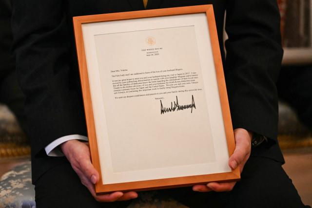 A letter from US President Donald Trump is seen before a meeting between family members of Japanese citizens abducted by North Korea and US President Donald Trump and Japan's Prime Minister Sanae Takaichi at the Akasaka State Guest House in Tokyo on October 28, 2025. (Photo by ANDREW CABALLERO-REYNOLDS / AFP)