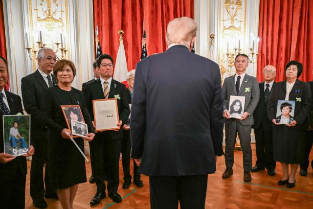 Family members of Japanese citizens abducted by North Korea meet with US President Donald Trump at the Akasaka State Guest House in Tokyo on October 28, 2025. (Photo by ANDREW CABALLERO-REYNOLDS / AFP)