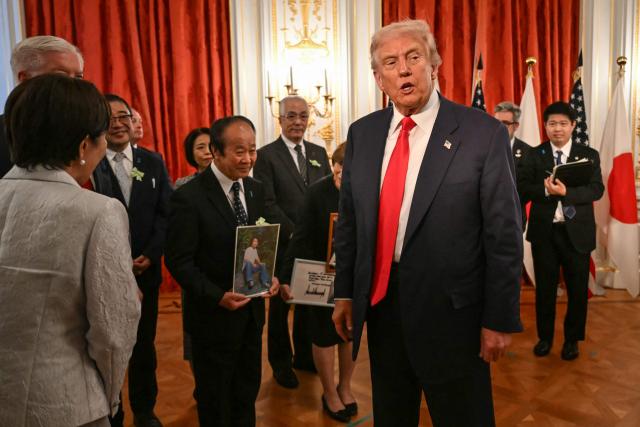 Family members of Japanese citizens abducted by North Korea meet with US President Donald Trump and Japan's Prime Minister Sanae Takaichi (L, back facing camera) at the Akasaka State Guest House in Tokyo on October 28, 2025. (Photo by ANDREW CABALLERO-REYNOLDS / AFP)