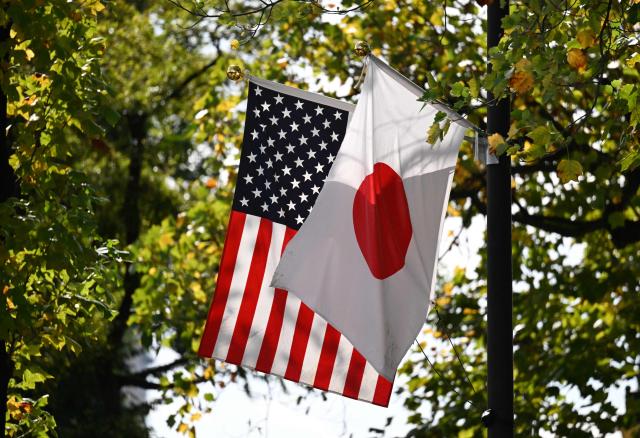 The Japanese and US flags fly outside the Akasaka Palace, where US President Donald Trump was meeting Japanese Prime Minister Sanae Takaichi, in Tokyo on October 28, 2025. (Photo by GREG BAKER / AFP)