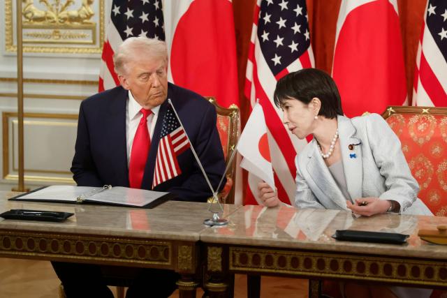 US President Donald Trump and Japan's Prime Minister Sanae Takaichi attend a signing ceremony at the Akasaka State Guest House in Tokyo on October 28, 2025. (Photo by Kiyoshi Ota / POOL / AFP)