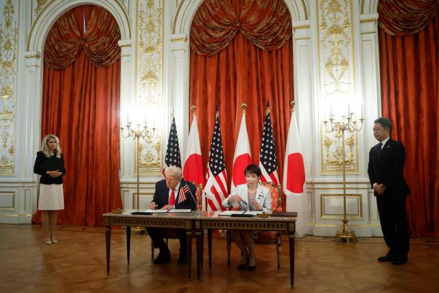 US President Donald Trump and Japan's Prime Minister Sanae Takaichi attend a signing ceremony at the Akasaka State Guest House in Tokyo on October 28, 2025. (Photo by Kiyoshi Ota / POOL / AFP)