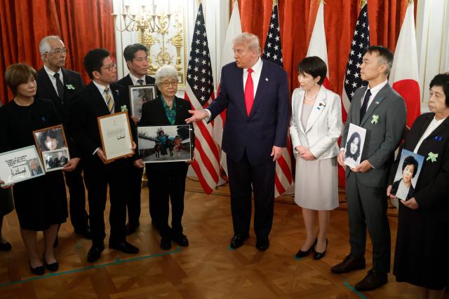 Family members of Japanese citizens abducted by North Korea meet with US President Donald Trump (C) and Japan's Prime Minister Sanae Takaichi (3rd R) at the Akasaka State Guest House in Tokyo on October 28, 2025. (Photo by Kiyoshi Ota / POOL / AFP)