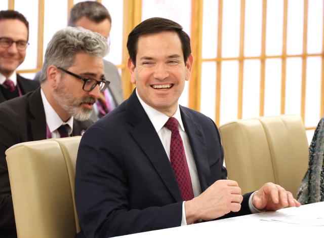 US Secretary of State Marco Rubio smiles as he talks with his Japanese counterpart Toshimitsu Motegi during their meeting at the Foreign Ministry in Tokyo on October 28, 2025. (Photo by YOSHIKAZU TSUNO / POOL / AFP)