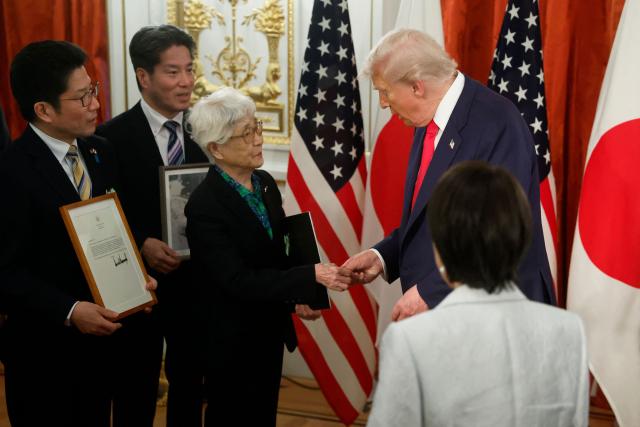 Family members of Japanese citizens abducted by North Korea meet with US President Donald Trump (R) and Japan's Prime Minister Sanae Takaichi (lower R) at the Akasaka State Guest House in Tokyo on October 28, 2025. (Photo by Kiyoshi Ota / POOL / AFP)