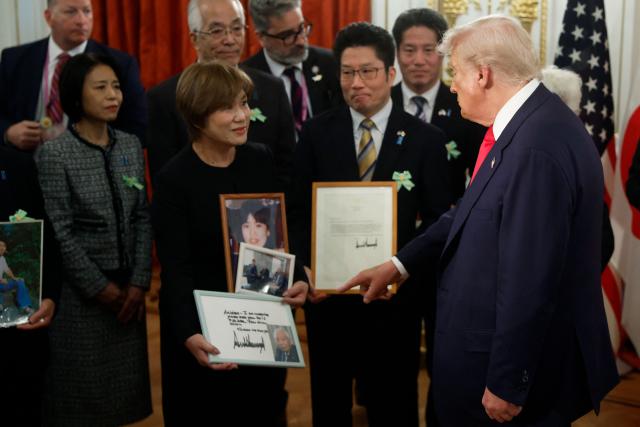 Family members of Japanese citizens abducted by North Korea meet with US President Donald Trump at the Akasaka State Guest House in Tokyo on October 28, 2025. (Photo by Kiyoshi Ota / POOL / AFP)