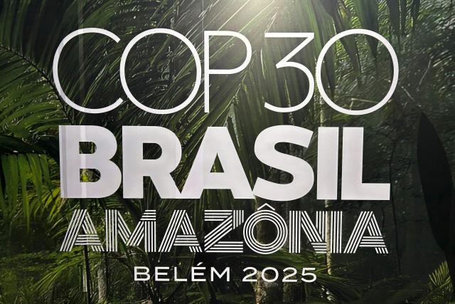 TOPSHOT - This view shows the COP30 logotype, at the Belem's airport in Para state, Brazil on October 25, 2025. (Photo by Thomas MORFIN / AFP)
