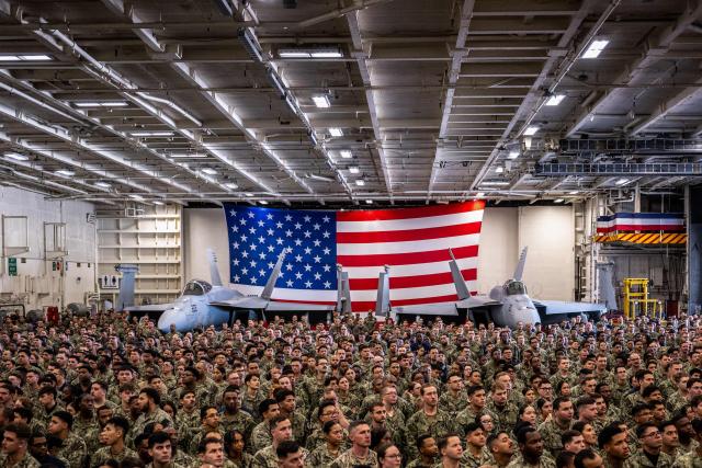 US Navy personnel look on during US President Donald Trump's visit to the USS George Washington aircraft carrier at the US naval base in Yokosuka on October 28, 2025. (Photo by Philip FONG / AFP)