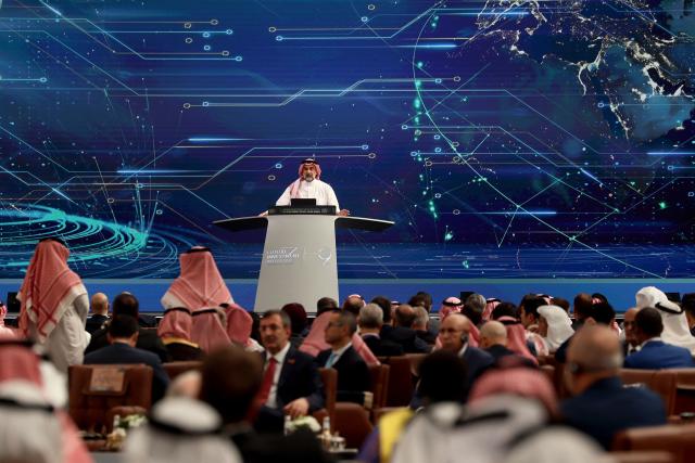 Yasir Al-Rumayyan, head of the Public Investment Fund, Saudi Arabia's influential sovereign wealth fund, addresses the opening ceremony of the Future Investment Initiative, in Riyadh on October 28, 2025. Saudi Arabia opened a major investment conference featuring heads of state and the global business elite on October 28, 2025, as it seeks support for its sprawling "gigaprojects" and sky-high AI ambitions. (Photo by Fayez Nureldine / AFP)