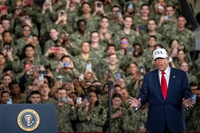 US President Donald Trump arrives to deliver a speech in front of US Navy personnel on board the US Navy's USS George Washington aircraft carrier at the US naval base in Yokosuka on October 28, 2025. (Photo by Philip FONG / AFP)