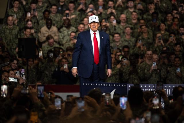 US President Donald Trump arrives to deliver a speech in front of US Navy personnel on board the US Navy's USS George Washington aircraft carrier at the US naval base in Yokosuka on October 28, 2025. (Photo by Philip FONG / AFP)