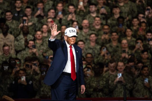 US President Donald Trump arrives to deliver a speech in front of US Navy personnel on board the US Navy's USS George Washington aircraft carrier at the US naval base in Yokosuka on October 28, 2025. (Photo by Philip FONG / AFP)