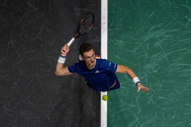 Czech Republic's Jiri Lehecka serves to Monaco's Valentin Vacherot during their men's singles match on day two of the Paris ATP Masters 1000 tennis tournament at the Paris La Défense Arena in Nanterre, on the outskirts of Paris, on October 28, 2025. (Photo by JULIEN DE ROSA / AFP)