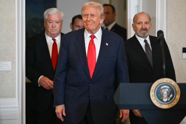 (L-R) US Ambassador to Japan George Glass, US President Donald Trump, and US Secretary of Commerce Howard Lutnick arrive for a business leaders event at the US embassy in Tokyo on October 28, 2025. (Photo by ANDREW CABALLERO-REYNOLDS / AFP)