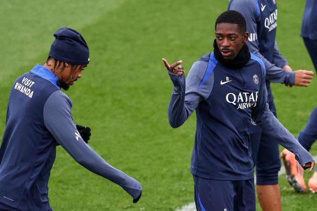 Paris Saint-Germain's French forward #10 Ousmane Dembele (R) speaks with Paris Saint-Germain's French forward #29 Bradley Barcola during a training session at the Campus Paris Saint-Germain in Poissy, west of Paris on October 28, 2025, in the eve of the L1 football match against Lorient. (Photo by FRANCK FIFE / AFP)