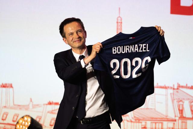 (FILES) Secretary General of the Horizons party and Paris Councilor Pierre-Yves Bournazel holds a jersey bearing his name and the year 2026, during the launch of his mayoral election campaign for the city of Paris, during a rally at the Trianon concert venue in Paris, on June 3, 2025. Renaissance, the Macronist party led by Gabriel Attal, is preparing to support Pierre-Yves Bournazel of the Horizons party in the Paris municipal elections on October 28, 2025, barring a reversal of fortune, while some of the party's leadership is leaning toward an alliance with Rachida Dati, who was also favored by Emmanuel Macron. (Photo by Emma DA SILVA / AFP)