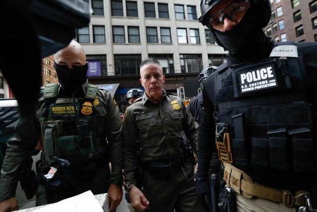 US Customs and Border Patrol Commander Gregory Bovino (C) arrives to federal court at Dirksen Federal Building in Chicago, Illinois on October 28, 2025. Bovino was ordered to appear in federal court for violating a temporary restraining order issued by District Judge Sara Ellis that orders immigration enforcement agents to limit use of tear gas and other crowd-suppression items except when there is an imminent threat. (Photo by KAMIL KRZACZYNSKI / AFP)