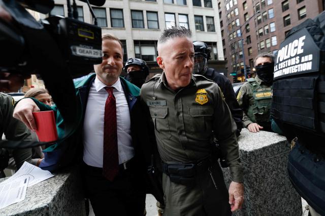 US Customs and Border Patrol Commander Gregory Bovino (R) arrives to federal court at Dirksen Federal Building in Chicago, Illinois on October 28, 2025. Bovino was ordered to appear in federal court for violating a temporary restraining order issued by District Judge Sara Ellis that orders immigration enforcement agents to limit use of tear gas and other crowd-suppression items except when there is an imminent threat. (Photo by KAMIL KRZACZYNSKI / AFP)