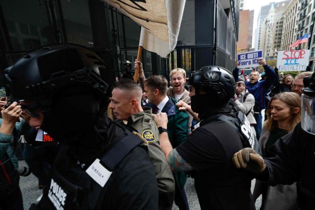 US Customs and Border Patrol Commander Gregory Bovino (C) arrives to federal court at Dirksen Federal Building in Chicago, Illinois on October 28, 2025. Bovino was ordered to appear in federal court for violating a temporary restraining order issued by District Judge Sara Ellis that orders immigration enforcement agents to limit use of tear gas and other crowd-suppression items except when there is an imminent threat. (Photo by KAMIL KRZACZYNSKI / AFP)