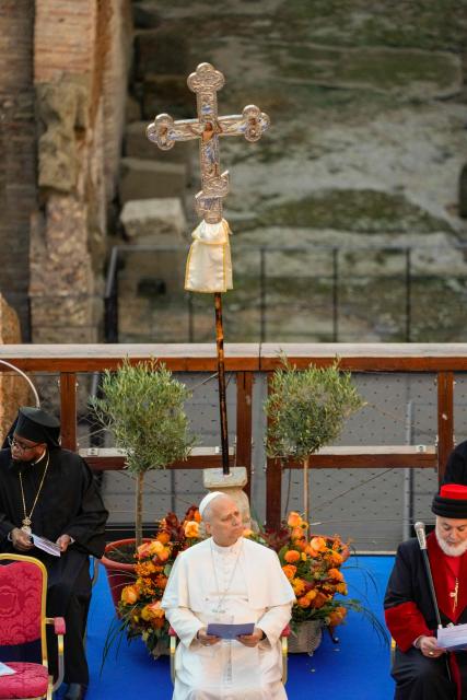 Pope Leo XIV attends an inter-religious meeting to pray for peace inside the Colosseum in Rome, on October 28, 2025 at the Colosseum in Rome. (Photo by Gregorio Borgia / POOL / AFP)