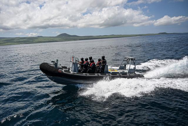 (FILES) Members of the Ecuadorean Navy prepare to carry out an exercise on board the Isla Isabela vessel (out of frame) in the sea off San Cristobal Island in the Galapagos Islands, Ecuador, on March 4, 2024. Ecuadoran President Daniel Noboa, a staunch US ally, said on October 28, 2025, that the South American nation could host a foreign military base on the Galapagos Islands, famous for their unique flora and fauna. (Photo by Ernesto BENAVIDES / AFP)