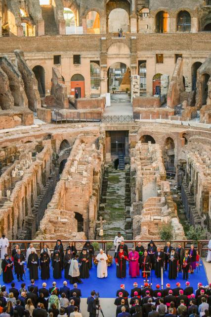 Pope Leo XIV attends an inter-religious meeting to pray for peace inside the Colosseum in Rome, on October 28, 2025. (Photo by Gregorio Borgia / POOL / AFP)