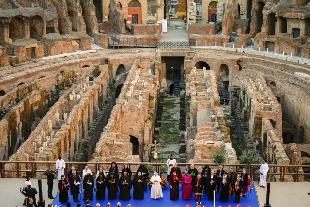 Pope Leo XIV attends an inter-religious meeting to pray for peace inside the Colosseum in Rome, on October 28, 2025. (Photo by Gregorio Borgia / POOL / AFP)