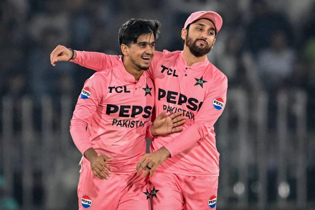 Pakistan's Saim Ayub (L) celebrates with captain Salman Agha after taking the wicket of South Africa's Matthew Breetzke during the first Twenty20 international cricket match between Pakistan and South Africa at Rawalpindi Cricket Stadium in Rawalpindi on October 28, 2025. (Photo by Farooq NAEEM / AFP)